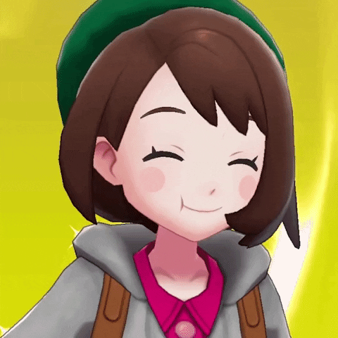 Cartoon girl from Pokemon lifting spoon to her mouth and smiling