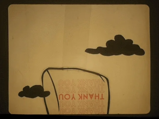 An animation depicting a hot air balloon made from a plastic bag. The bag's text reads, 