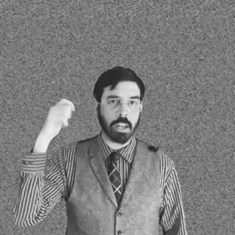 A man in office clothing points and says, 