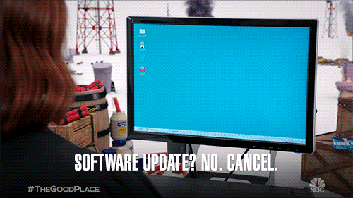 Two women in front of a computer screen saying, 'Software update? No. Cancel. Why is it doing it now?!'