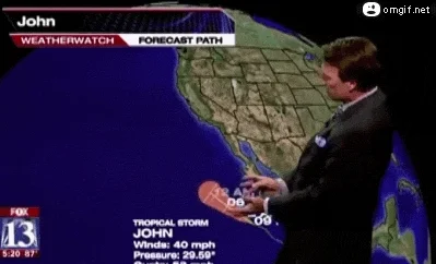 A weather reporter is saying something and gesturing at a weather map.