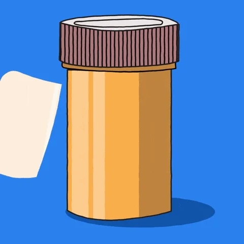 :Pill bottle. The label says, 