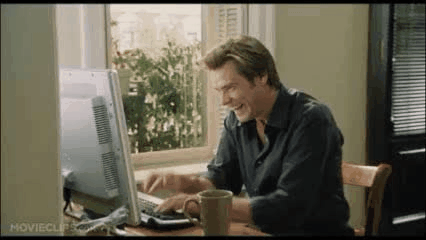 Man typing excitedly on keyboard 