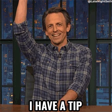 Actor Seth Myers, raises his right hand, saying 'I have a tip.'