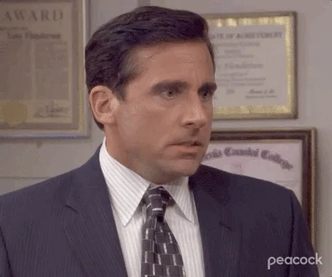 Michael Scott from The Office looks distressed, shouting 