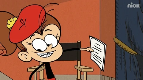 A cartoon child wearing a beret sitting in a director's chair calling out 