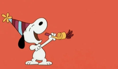GIF of Snoopy blowing a party horn