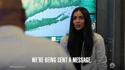 A woman tries to convince her colleagues: 'We're being sent a message.'