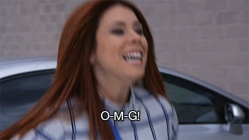 A woman jumping and saying, 
