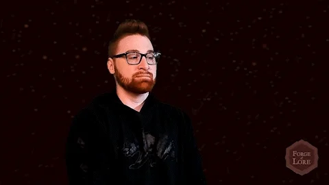 A bearded man wearing glasses says, 