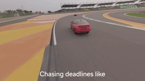 A race car chasing behind another race car with the following caption overlaid: "Chasing deadlines like"