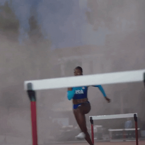 An athlete jumping over hurdles