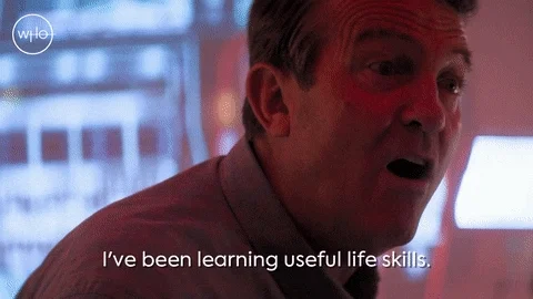 A close-up of a man speaking with the caption ‘I've been learning useful life skills’ displayed below him.