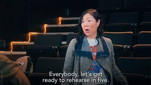 A stage manager in a theatre saying, 