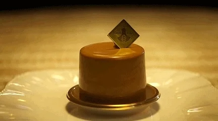 A fork cutting into a tart, showing its creamy filling.