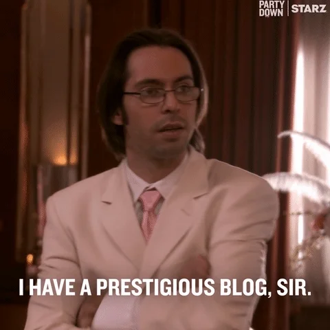 A man in a suit says, 'I have a prestigious blog, sir.'