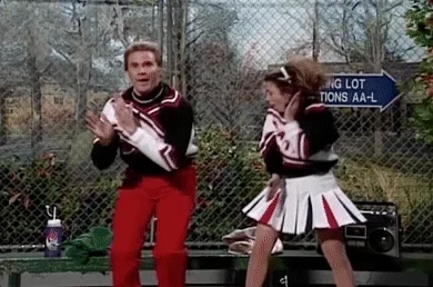 Two cheerleaders are dancing.