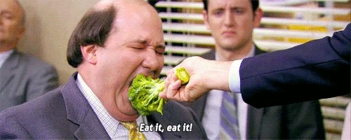 A character from The Office being forced to eat broccoli, with the caption 