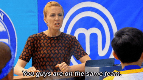 A gameshow host telling two contestants, 'You guys are on the same team.'