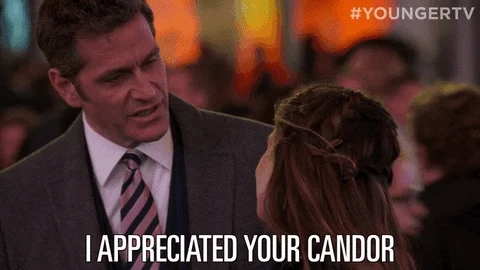 A man in a suit nods and says to a woman, 'I appreciated your candor.'