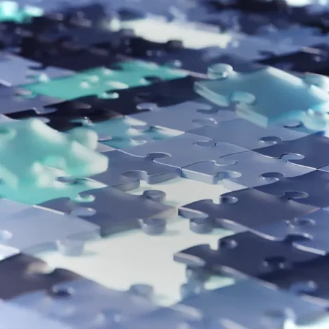 An animation of jigsaw puzzle pieces connecting.