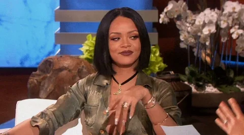 Rihanna winking and saying, 