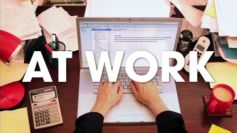 A desk with hands typing on a laptop surrounded by office supplies. The text reads: 