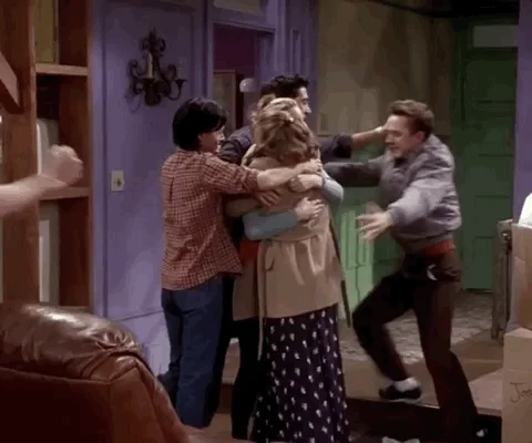 The cast of Friends hugging.