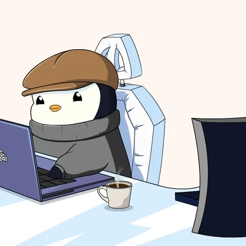 A cartoon penguin working productively, switching from one computer to another.