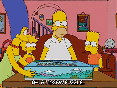 The Simpson's family is looking at a Jigsaw Puzzle called 