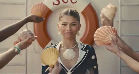 Zendaya on a yacht, surround by clam shells. She says, 