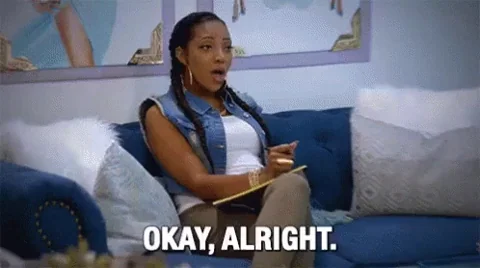 A person taking notes and saying, "Okay, alright."