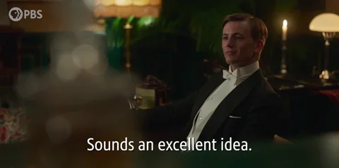A man in tuxedo saying, 'Sounds an excellent idea.'