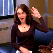Woman giving herself a high five and motioning to the other person as if sending them a high five.