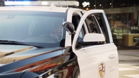 Police officer exiting their police vehicle