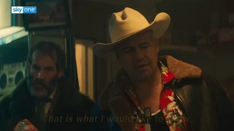 GIF: Man in cowboy hat and red Hawaiian shirt says, 