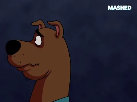 Scooby doo listening with his ear perked up with a curious face.