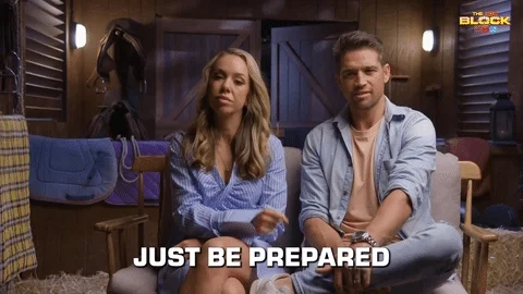 A man and woman sitting on couch. One says, 