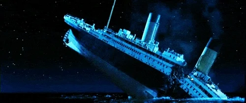 Titanic breaking off into the ocean.