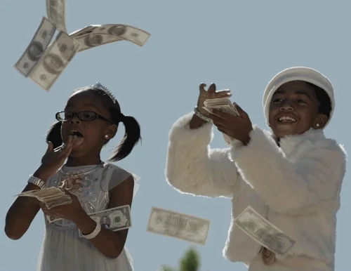 Children throwing dollar bills around.