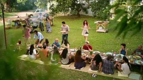 A group of friends having a picnic in a park.