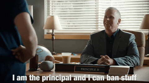 A principal at his desk saying, 