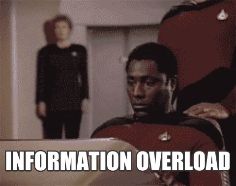 A  Star Trek character touching his face and screaming. The text reads, 'Information Overload'.