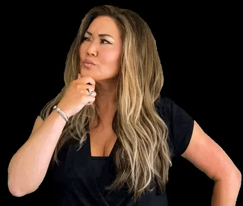 A woman strokes her chin, as if thinking deeply about something.