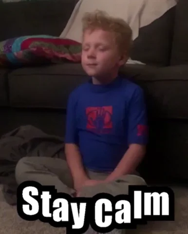 A boy who is taking a deep breath