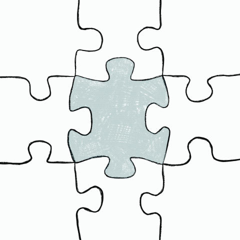 white puzzle pieces fitting together except the one in the middle which is grey