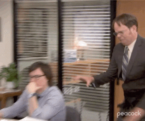 Dwight from The Office stands on a table and yells, text reads 