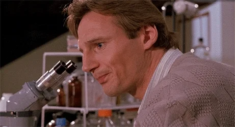 data analytics with excel: Liam Neeson looking into a microscope and asking, 