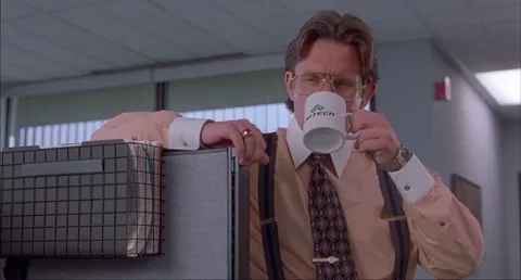 The boss from the movie Office Space drinking coffee. 