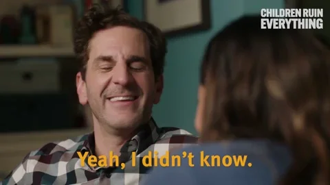 A laughing man says, "Yeah, I didn't know. You caught me."